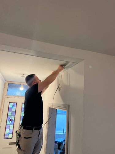 Man installing new wires in Kingston